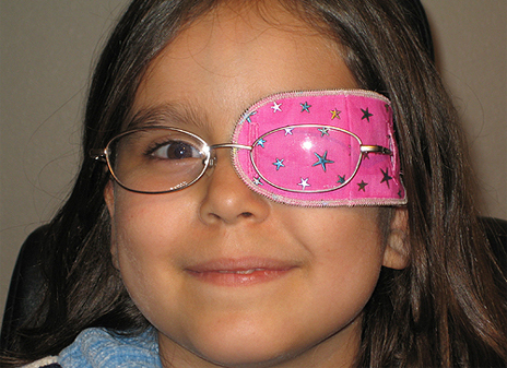 Girl with pink eye patch image