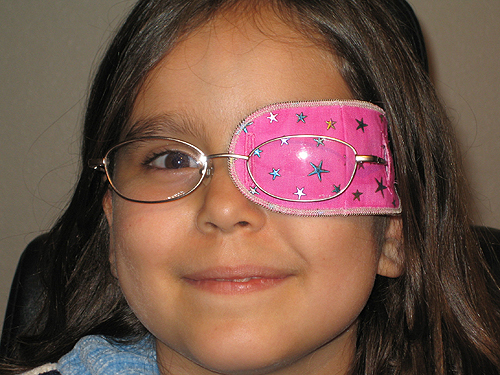 Child with pink eye patch image