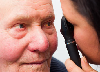 Doctor inspecting patients eye image